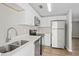 Bright kitchen with stainless steel appliances, quartz countertops, and modern cabinetry at 1826 Cadillac Cir, Tampa, FL 33619