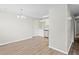 Open concept living space with updated flooring and kitchen view at 1826 Cadillac Cir, Tampa, FL 33619