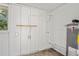 Image shows the utility room with a water heater, a window and electrical components at 1826 Cadillac Cir, Tampa, FL 33619