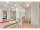 Bathroom boasts a spacious layout with a shower, toilet, sink, and light pink tiles and countertops at 18561 Winding Oaks Blvd, Hudson, FL 34667