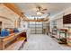 Messy garage with disorganized tools and pegboard walls at 18561 Winding Oaks Blvd, Hudson, FL 34667