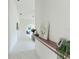 Hallway features art and decor, offering a glimpse into the home's layout and design at 18561 Winding Oaks Blvd, Hudson, FL 34667