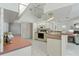 Cozy kitchen with white cabinetry, tile floors, and a breakfast bar at 18561 Winding Oaks Blvd, Hudson, FL 34667