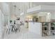 Open kitchen with a breakfast bar, bright light, and an inviting dining area, perfect for modern living at 18561 Winding Oaks Blvd, Hudson, FL 34667