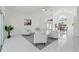 Bright living room with high ceilings, tile floors, and a dining area; great for entertaining at 18561 Winding Oaks Blvd, Hudson, FL 34667