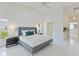 Bright main bedroom with high ceilings, tile floors, and plenty of natural light at 18561 Winding Oaks Blvd, Hudson, FL 34667