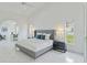 Spacious main bedroom with an archway, tile floors, and ample light creates a serene and inviting retreat at 18561 Winding Oaks Blvd, Hudson, FL 34667