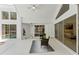 Enclosed patio with high ceilings features sliding glass doors and overlooks the backyard pool at 18561 Winding Oaks Blvd, Hudson, FL 34667