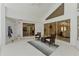 Enclosed patio features vaulted ceilings, sliding glass doors and stylish furniture, creating an airy space at 18561 Winding Oaks Blvd, Hudson, FL 34667