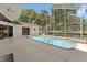 Sparkling screened-in pool and spa offer a refreshing escape in this beautiful backyard setting at 18561 Winding Oaks Blvd, Hudson, FL 34667