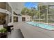 Enjoy the screened-in pool, spa, and spacious deck, providing an ideal outdoor experience at 18561 Winding Oaks Blvd, Hudson, FL 34667