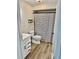 Updated bathroom features a vanity, toilet, and modern striped shower curtain at 1884 Clearbrooke Dr, Clearwater, FL 33760