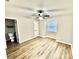 Bright bedroom with vinyl flooring, a ceiling fan, a closet, and a window for natural light at 1884 Clearbrooke Dr, Clearwater, FL 33760