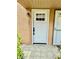 Inviting front entrance with a white door and classic black hardware, creating a welcoming first impression at 1884 Clearbrooke Dr, Clearwater, FL 33760