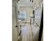 Galley kitchen features stainless steel appliances, white cabinets, and granite countertops providing a modern feel at 1884 Clearbrooke Dr, Clearwater, FL 33760