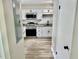 Modern kitchen with stainless steel appliances, granite countertops, white cabinets, and a stylish backsplash at 1884 Clearbrooke Dr, Clearwater, FL 33760