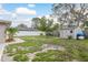 Spacious backyard featuring shed, mature trees, and partial fence at 2005 Jefferson Ave, Dunedin, FL 34698