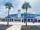 Exterior of TD Ballpark, home of the Toronto Blue Jays during spring training, framed by palm trees at 2005 Jefferson Ave, Dunedin, FL 34698