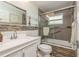 Bathroom with sleek tile accents, a glass-enclosed shower, and a modern vanity at 2005 Jefferson Ave, Dunedin, FL 34698