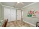 Bedroom with closet, a doorway, neutral color walls and tile floor at 2005 Jefferson Ave, Dunedin, FL 34698