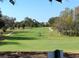 Picturesque golf course offering lush greenery, challenging play, and serene views for golf enthusiasts at 2005 Jefferson Ave, Dunedin, FL 34698