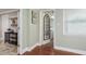 Open hallway showcases wood floors and access to the laundry room at 2005 Jefferson Ave, Dunedin, FL 34698