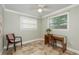 Corner office with natural light from two windows, tile floor, and built-in desk at 2005 Jefferson Ave, Dunedin, FL 34698