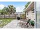 Outdoor patio with stone pavers, lounge chairs, and a grill is perfect for entertaining and relaxation at 2005 Jefferson Ave, Dunedin, FL 34698