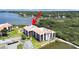 An aerial view showcasing the property's proximity to the bay and surrounded by mangrove forests and a serene pond at 244 Mariner Dr, Tarpon Springs, FL 34689