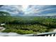Stunning balcony view overlooking lush greenery, trees, and blue skies at 244 & 243 Mariner Dr # 243-244, Tarpon Springs, FL 34689