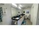 Bright bathroom with double sinks, granite countertops, white cabinets, and modern fixtures for a clean, updated look at 244 & 243 Mariner Dr # 243-244, Tarpon Springs, FL 34689