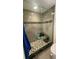 Modern walk-in shower with glass enclosure, tiled walls, and built-in bench, creating a spa-like experience at 244 & 243 Mariner Dr # 243-244, Tarpon Springs, FL 34689