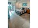 Well-lit bedroom with access to a balcony, showcasing a neutral color palette and ample natural light at 244 & 243 Mariner Dr # 243-244, Tarpon Springs, FL 34689