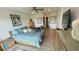 Bedroom featuring a bed with a colorful comforter at 244 & 243 Mariner Dr # 243-244, Tarpon Springs, FL 34689