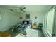 Bright bedroom featuring a ceiling fan, closet, and a large window allowing ample natural light at 244 & 243 Mariner Dr # 243-244, Tarpon Springs, FL 34689