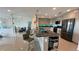 Bright kitchen with a large kitchen island and modern stainless steel appliances at 244 & 243 Mariner Dr # 243-244, Tarpon Springs, FL 34689