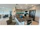 Stylish kitchen with granite countertops, a central island, and open layout to living area at 244 & 243 Mariner Dr # 243-244, Tarpon Springs, FL 34689