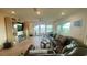Living room with sliding glass doors and a view of the water at 244 & 243 Mariner Dr # 243-244, Tarpon Springs, FL 34689