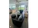 Bright and airy living space features sleek tile flooring, plush seating, and scenic outdoor views at 244 & 243 Mariner Dr # 243-244, Tarpon Springs, FL 34689