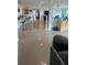 Expansive open-concept living space with modern finishes and design touches, including tile flooring at 244 & 243 Mariner Dr # 243-244, Tarpon Springs, FL 34689