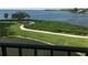 Beautiful water view from a balcony overlooking lush greenery and tranquil waters at 244 & 243 Mariner Dr # 243-244, Tarpon Springs, FL 34689