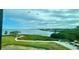 Expansive water views and lush green landscaping create a serene and picturesque setting at 244 & 243 Mariner Dr # 243-244, Tarpon Springs, FL 34689