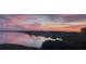 Breathtaking water views at sunset create a stunning backdrop for this waterfront home at 244 & 243 Mariner Dr # 243-244, Tarpon Springs, FL 34689