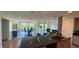 Modern kitchen open to dining area, featuring sleek granite countertops and neutral toned cabinets at 244 Mariner Dr, Tarpon Springs, FL 34689