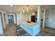 Open kitchen with an island, bar seating, and modern fixtures, perfect for entertaining and casual dining at 244 Mariner Dr, Tarpon Springs, FL 34689