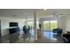 Open-concept living space with sleek tile floors, floor to ceiling windows showcasing a stunning view, and modern decor at 244 Mariner Dr, Tarpon Springs, FL 34689