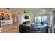 Open-concept living room with a large sectional sofa and a view of the waterfront at 244 Mariner Dr, Tarpon Springs, FL 34689