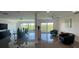 Open-concept living space with sleek tile floors, floor to ceiling windows showcasing an abundance of natural light at 244 Mariner Dr, Tarpon Springs, FL 34689