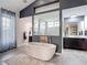Luxurious primary bathroom featuring a soaking tub and dual vanities for relaxation at 28410 Wildlife Ln, Brooksville, FL 34602