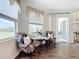 Cozy breakfast nook with a table, chairs, and bright views of the surrounding landscape at 28410 Wildlife Ln, Brooksville, FL 34602